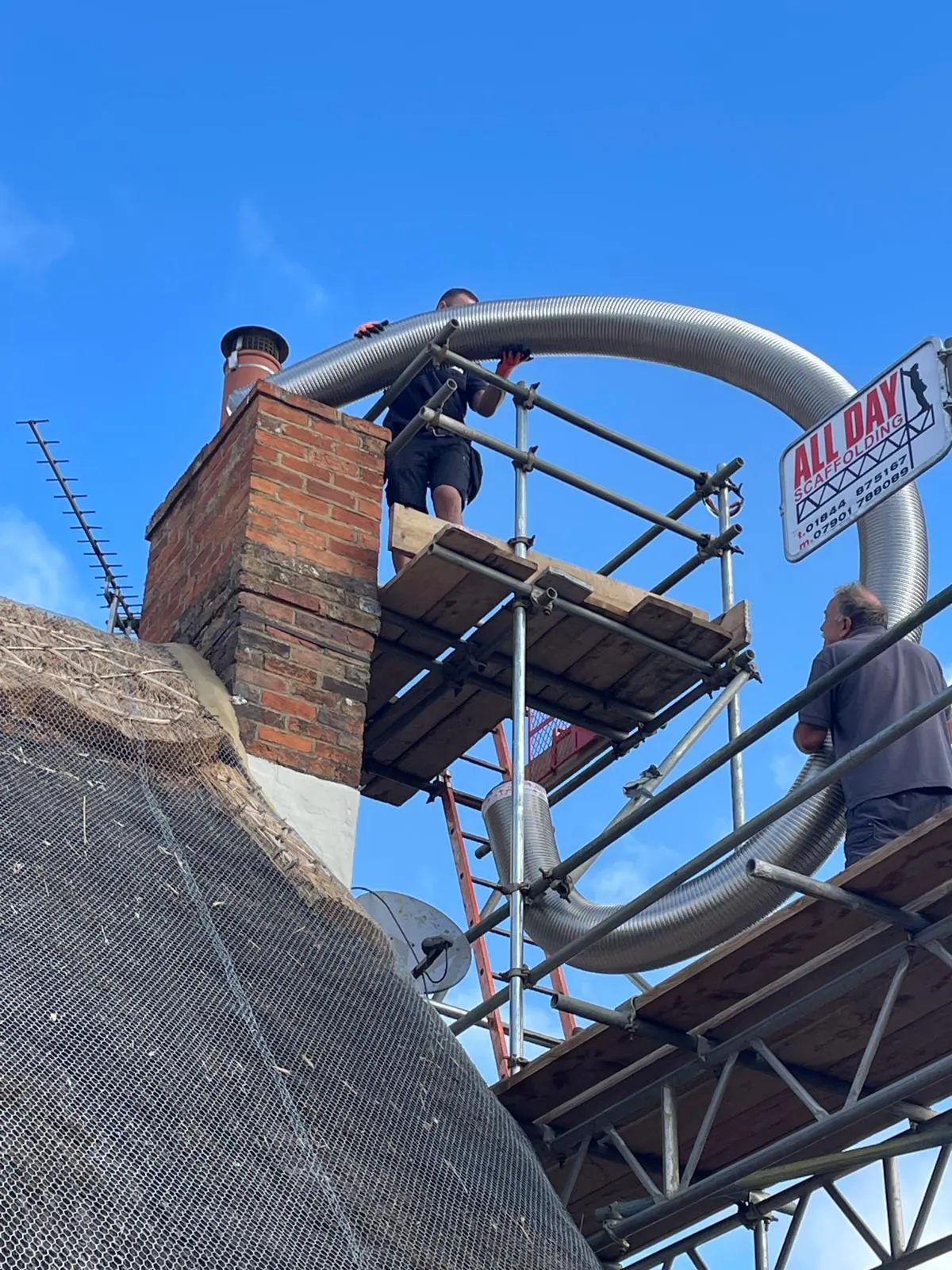 Feeding the new extractor flue up to the chimney stack