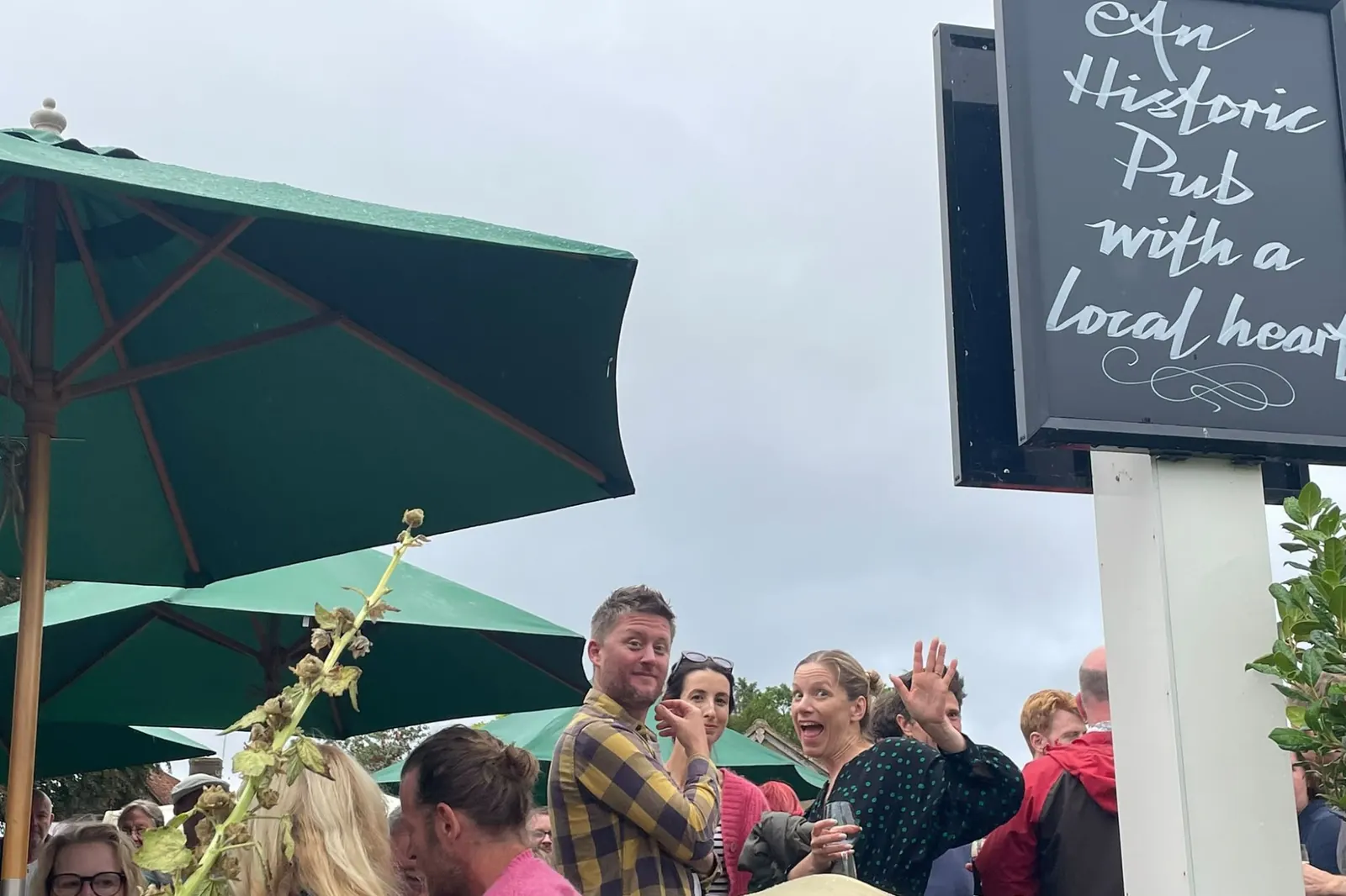 A wave from under the sign